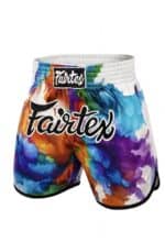 Colorful artistic fight shorts with "Fairtex" logo, ideal for Muay Thai and combat sports.